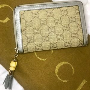 Gucci Metallic Silver bamboo tassel zip wallet